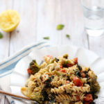 Comforting Kitchen Sink Pasta with Artichokes, Tomatoes, Kale, Broccoli and Vegan Sunflower Seed Alfredo