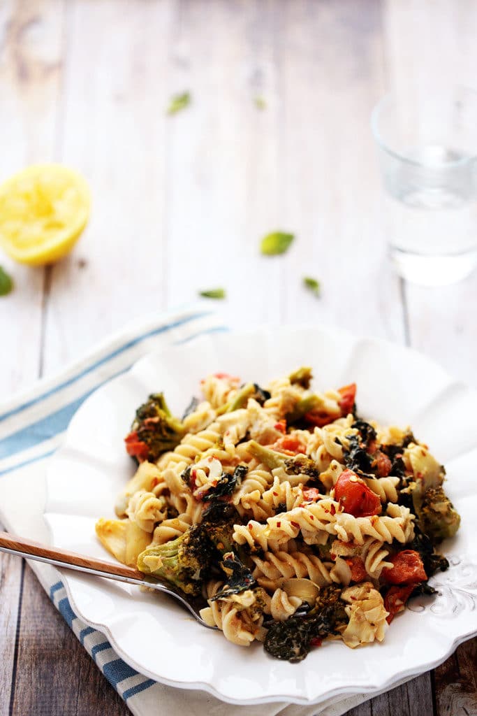 Comforting Kitchen Sink Pasta with Artichokes, Tomatoes, Kale, Broccoli and Vegan Sunflower Seed Alfredo