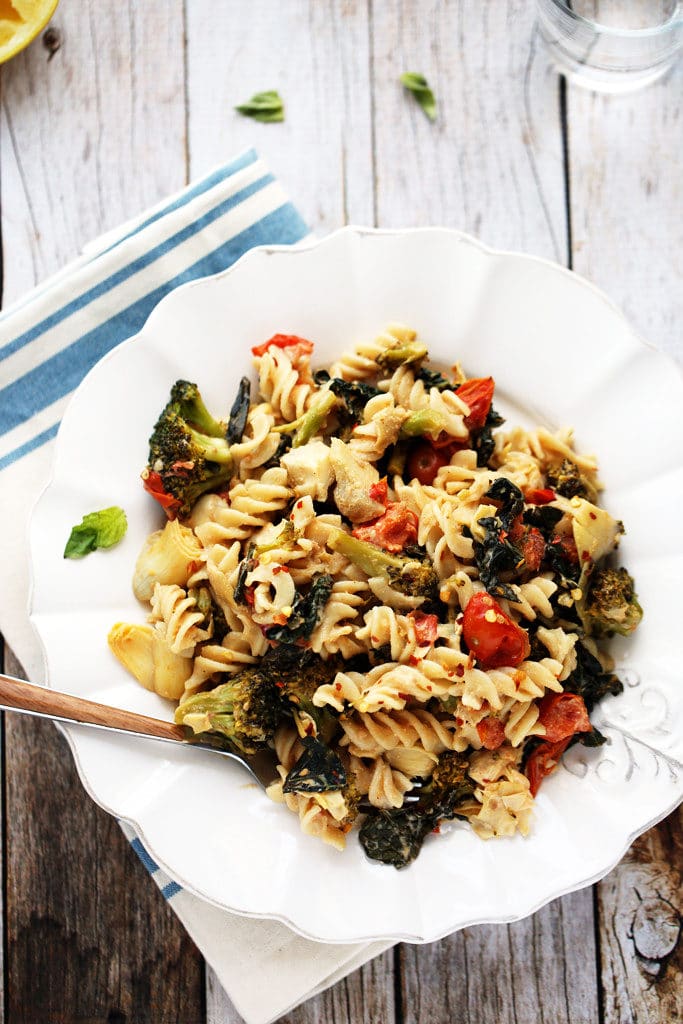 Comforting Kitchen Sink Pasta with Artichokes, Tomatoes, Kale, Broccoli and Vegan Sunflower Seed Alfredo