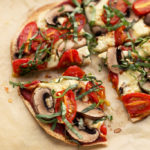 Personal Tortilla Pizza with Homemade Mozzarella, Mushrooms, Tomatoes & Basil (Vegan)