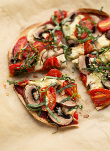 Personal Vegan Tortilla Pizza with Homemade Mozzarella, Mushrooms, Tomatoes, & Basil | Quick, easy, and super crispy!