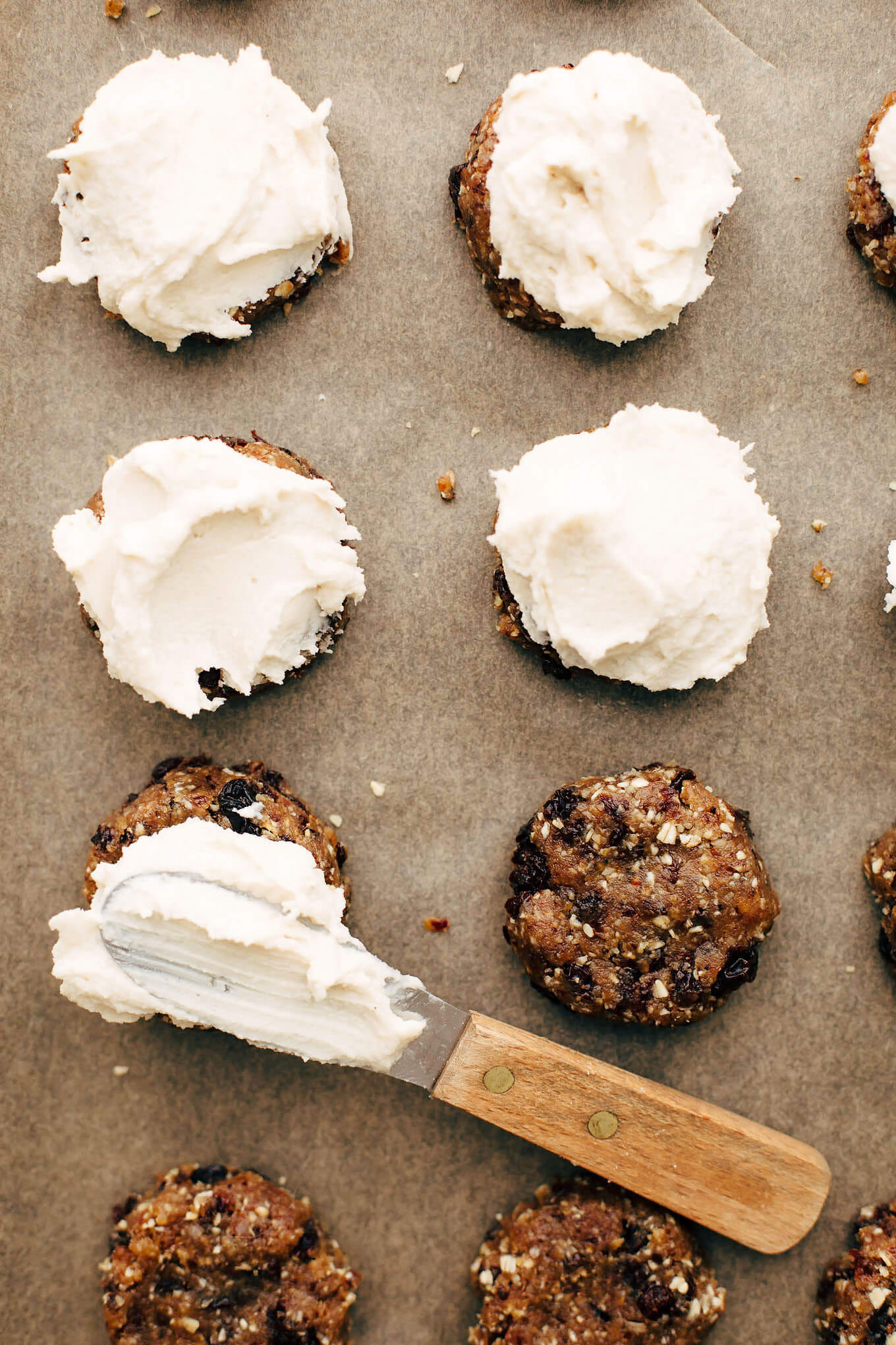 Almost Raw Vegan Oatmeal Raisin Cookies with Vanilla Cashew Buttercream